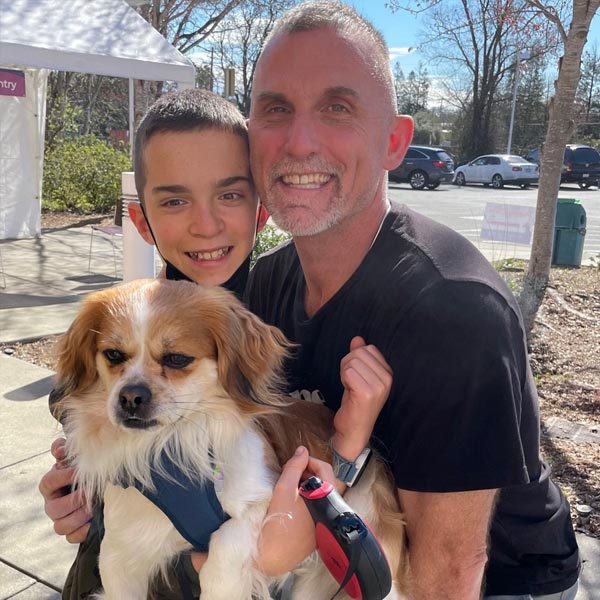 Family with dog at the spay/neuter clinic