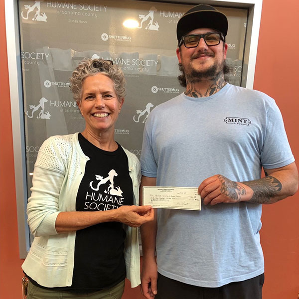 The United Flyers of Sonoma Disc Club representative giving a check for $3200 to Priscilla Locke, HSSC Communications and Development Director