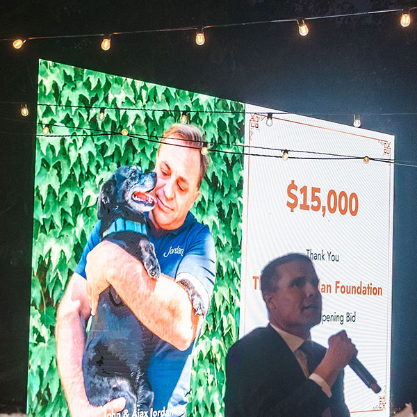 Mike McGuire announcing the $15,000 opening bid from the John Jordan Foundation