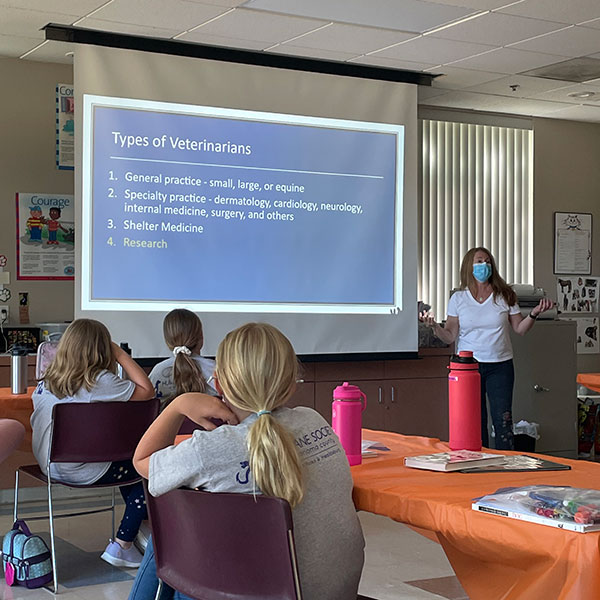 Veterinarian giving presentation to Afterschool Animal Academy